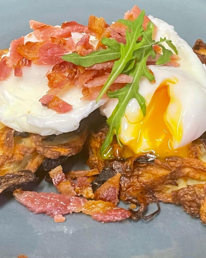 Poached eggs and rosti with bacon at Toast Coffee House